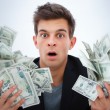 Closeup of a young business man holding money