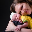 Happy young mother and newborn girl